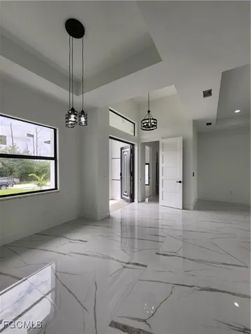a kitchen with kitchen island a stove and a refrigerator