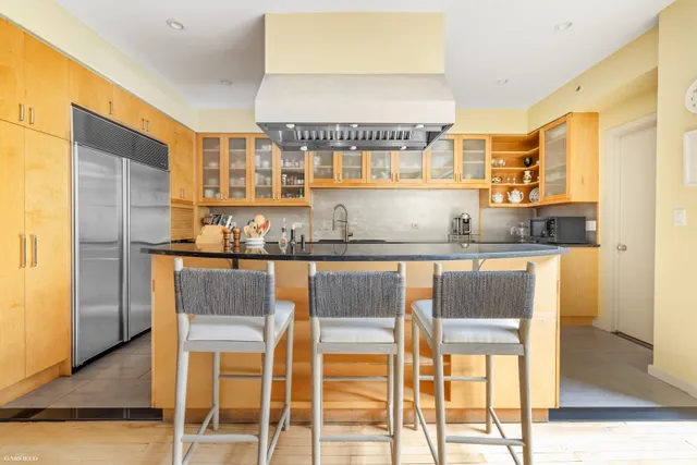 a kitchen with a table chairs and floors