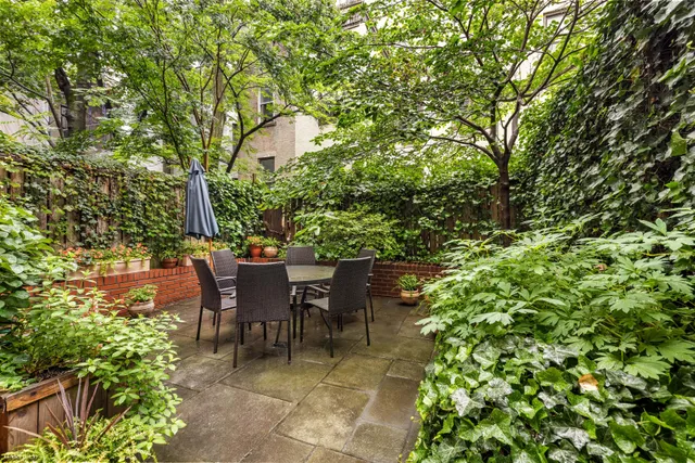 a kitchen with granite countertop a counter space and stainless steel appliances