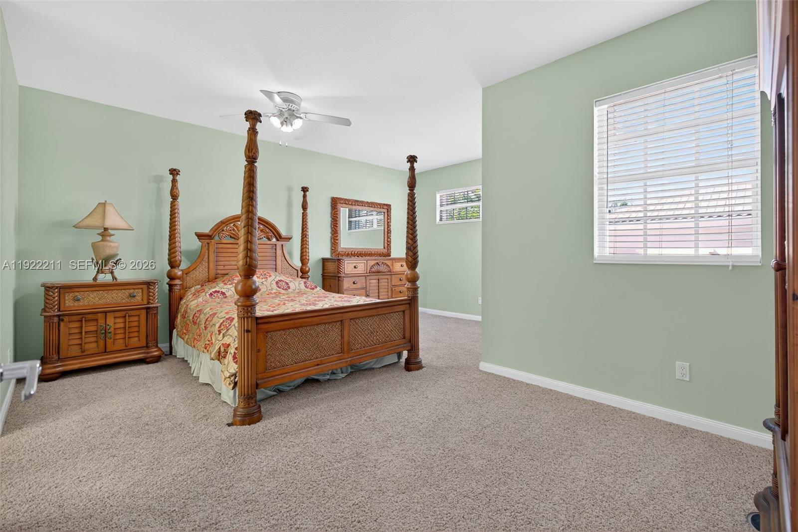 3518 Community Drive Jupiter, FL 33458 - Photo 15 of 38 a bedroom with a bed and a dresser