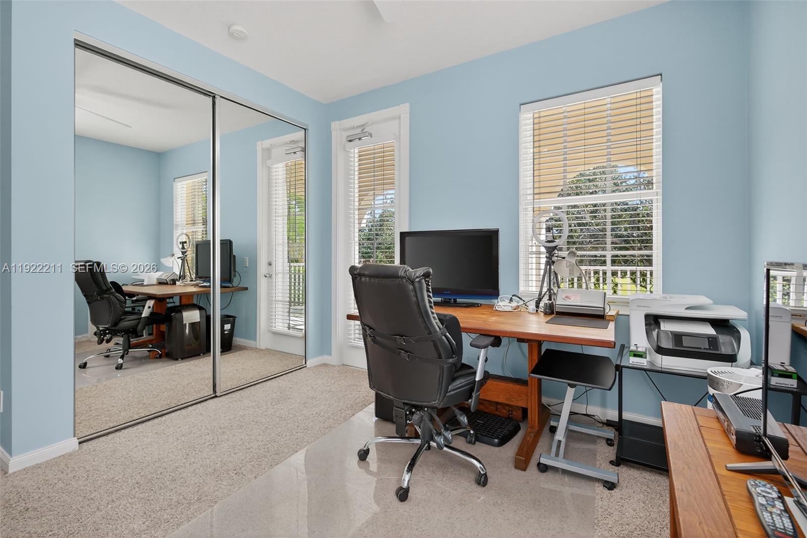 3518 Community Drive Jupiter, FL 33458 - Photo 19 of 38 a view of a workspace with furniture and a window