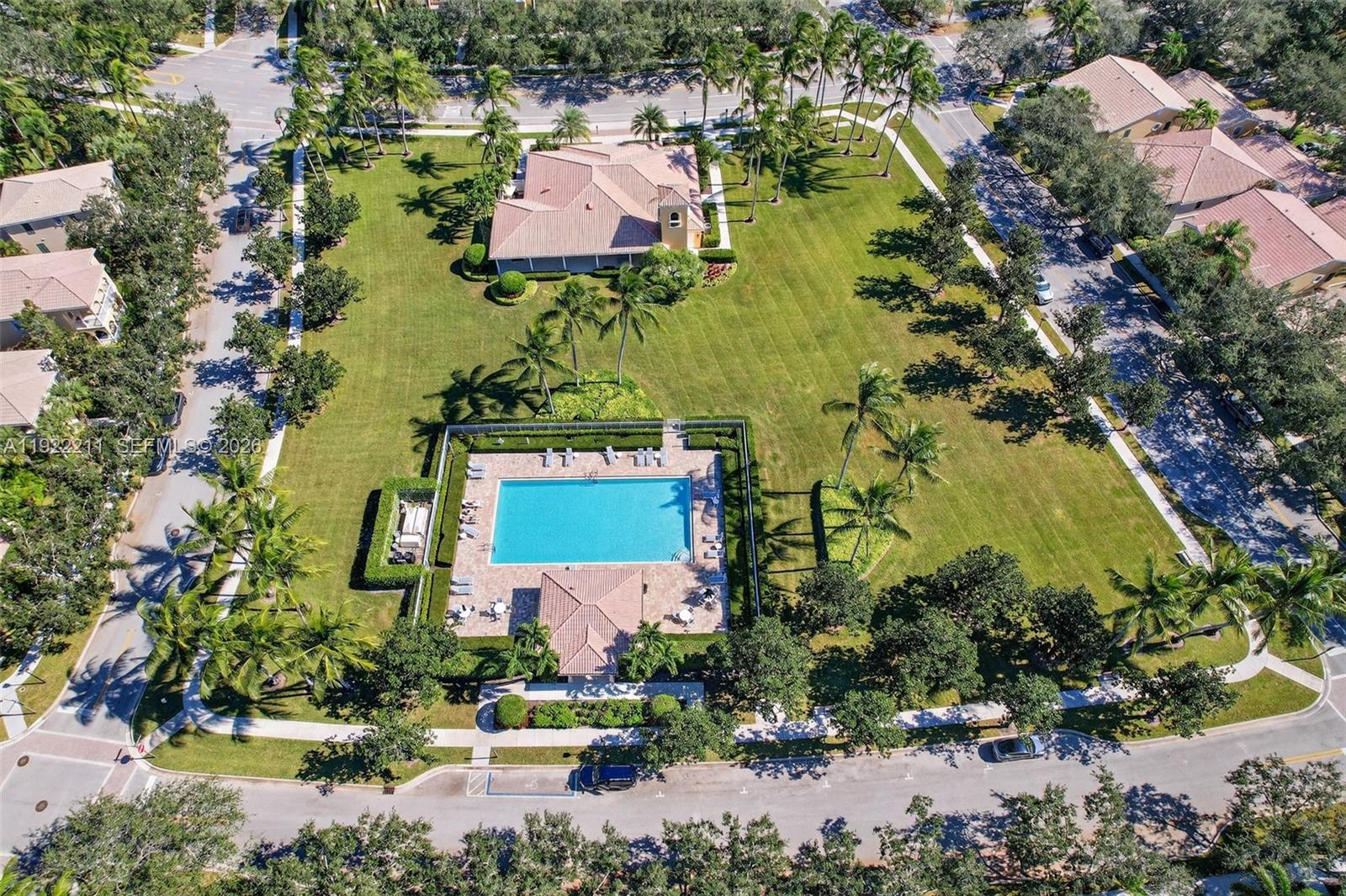 3518 Community Drive Jupiter, FL 33458 - Photo 32 of 38 an aerial view of a house with a garden and swimming pool