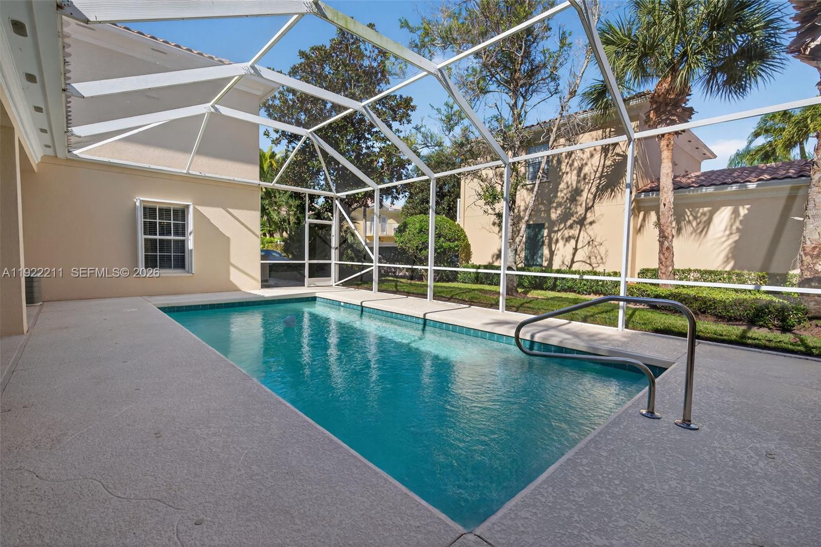 3518 Community Drive Jupiter, FL 33458 - Photo 36 of 38 a view of a house with a swimming pool