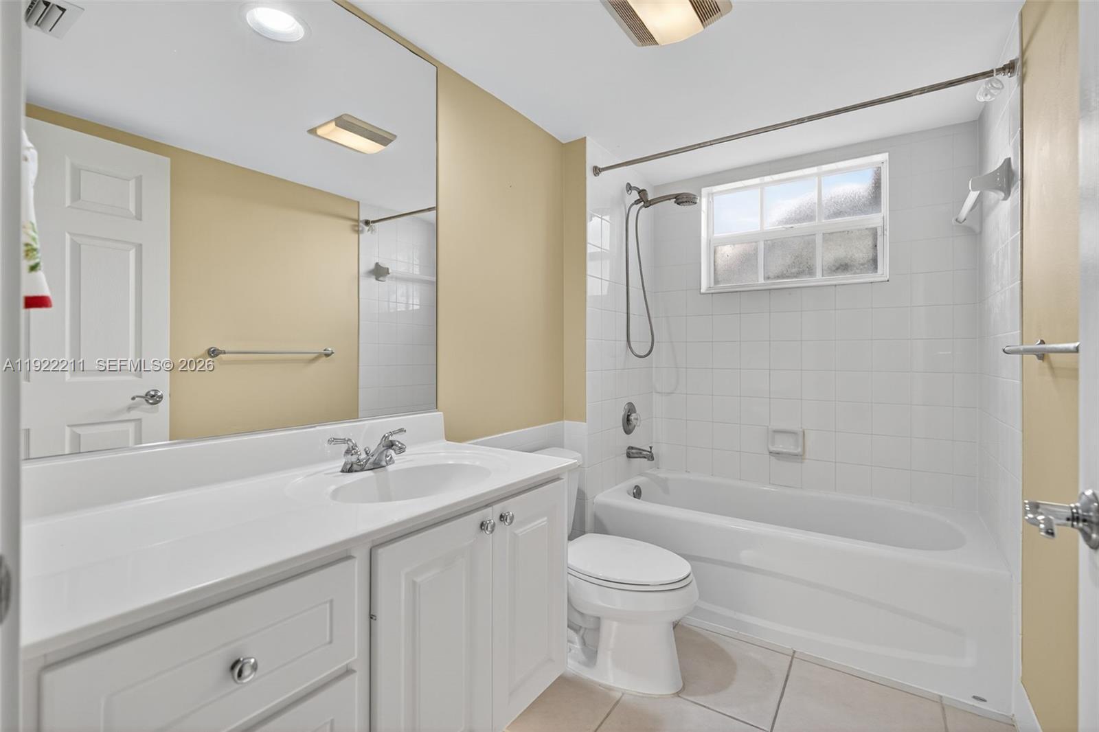 3518 Community Drive Jupiter, FL 33458 - Photo 8 of 38 a bathroom with a sink a toilet and shower