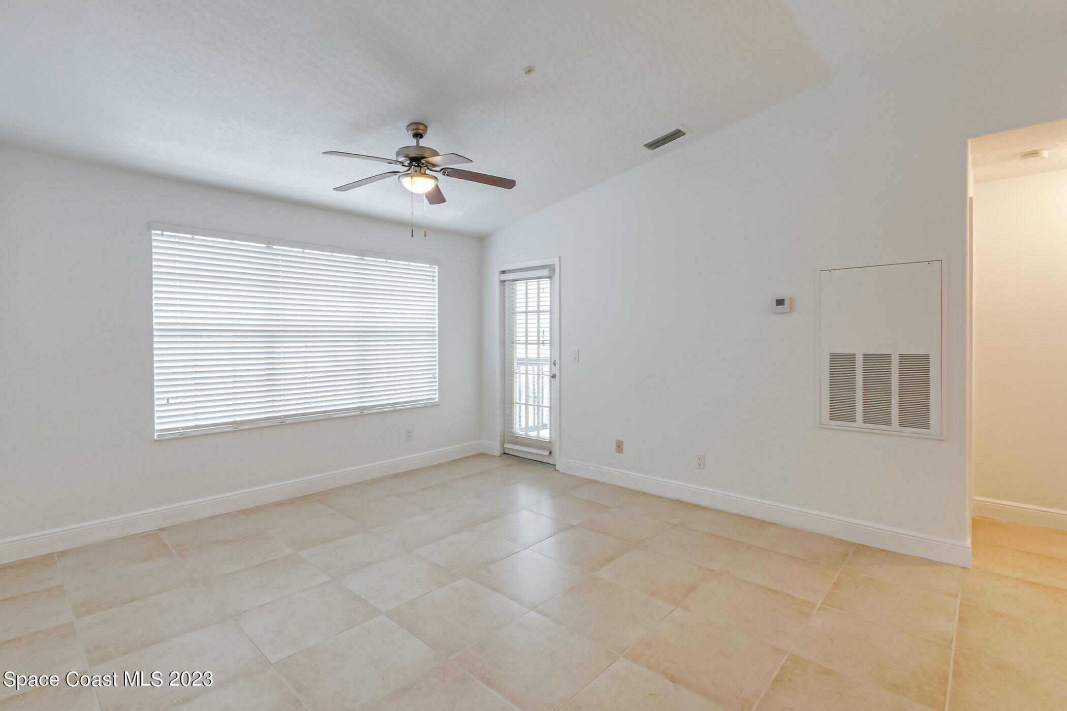 7667 North Wickham Road, Unit 617 Melbourne, FL 32940 - Photo 7 of 44 a view of an empty room with a window