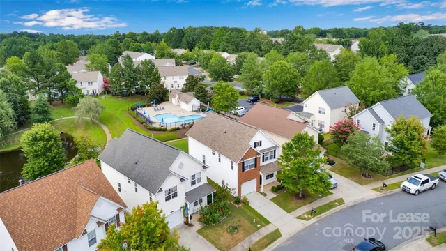 an aerial view of a house with a garden