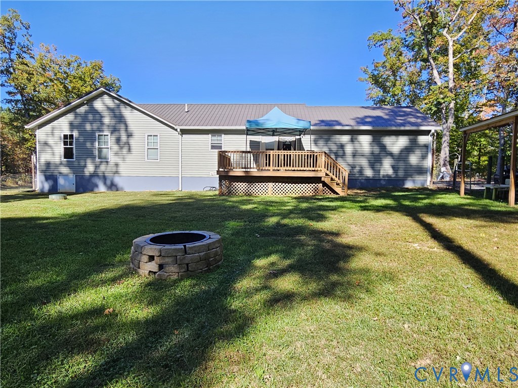 3286 Ranson Road Dillwyn, VA 23936 - Photo 19 of 25 a backyard of a house with table and chairs
