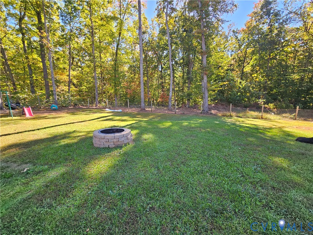 3286 Ranson Road Dillwyn, VA 23936 - Photo 22 of 25 a backyard of a house with swimming pool and large trees