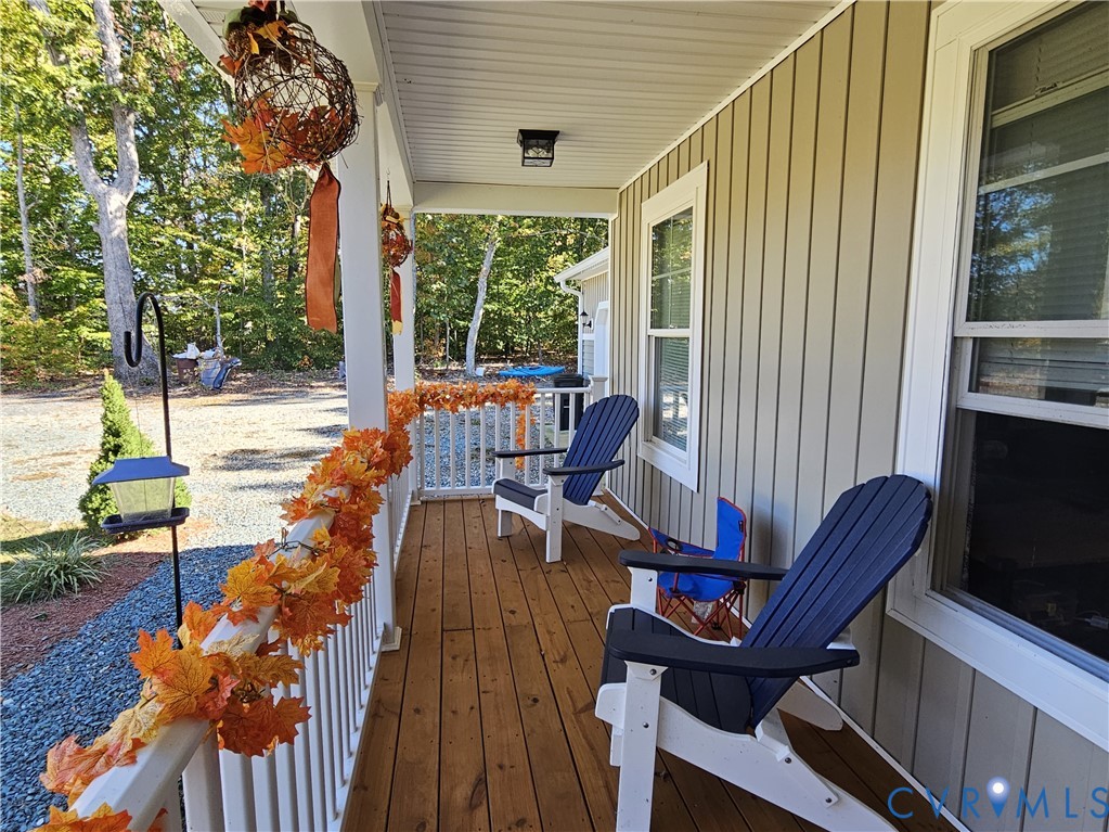 3286 Ranson Road Dillwyn, VA 23936 - Photo 4 of 25 a living room with furniture and a floor to ceiling window