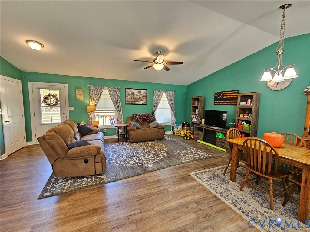 3286 Ranson Road Dillwyn, VA 23936 - Photo 5 of 25 a living room with furniture and a chandelier
