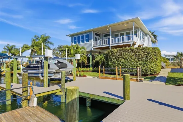 a view of an chairs and table in the patio