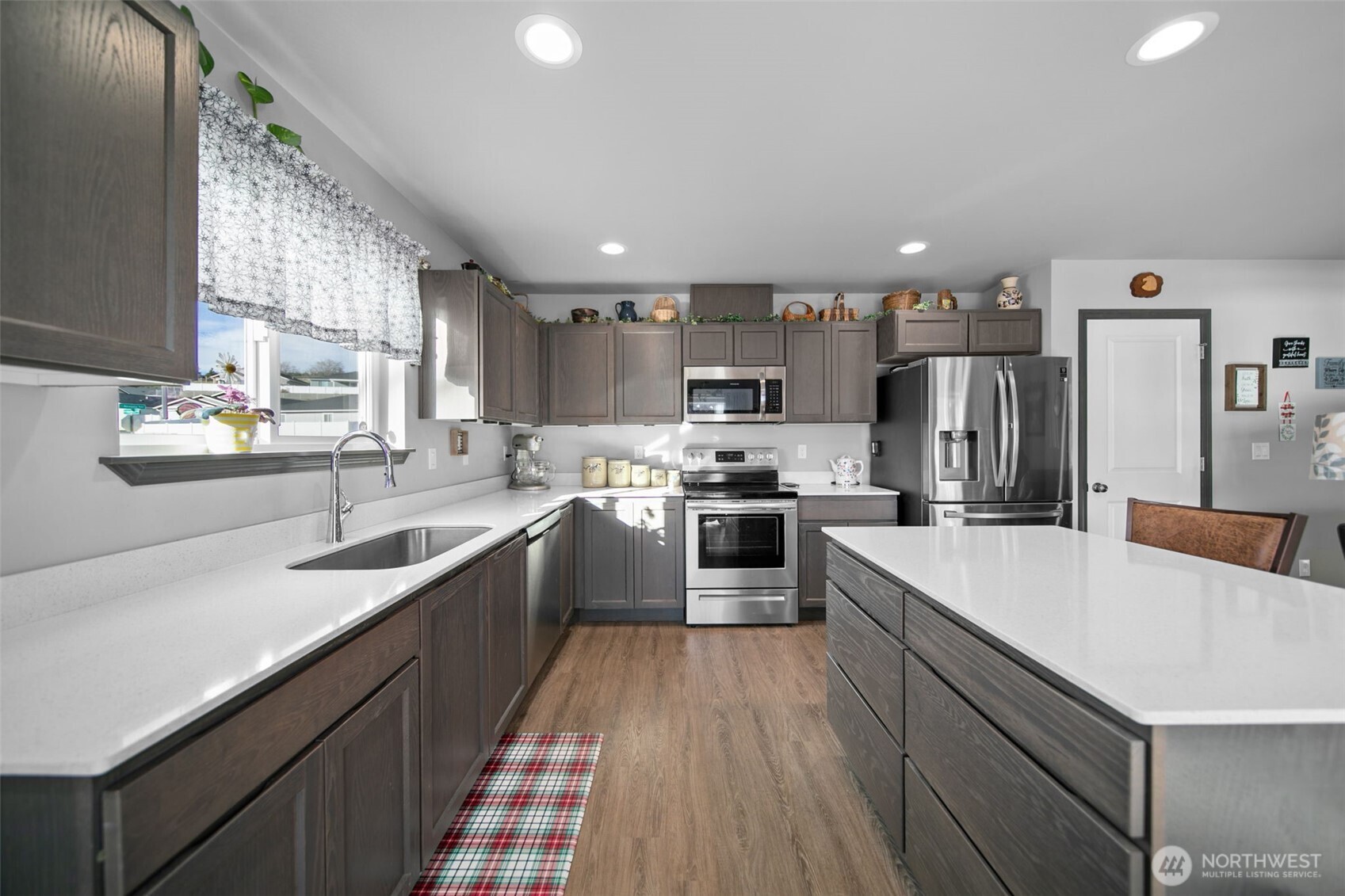 2314 Southeast Marlette Road East Wenatchee, WA 98802 - Photo 6 of 27 a kitchen with stainless steel appliances granite countertop a sink dishwasher stove and refrigerator