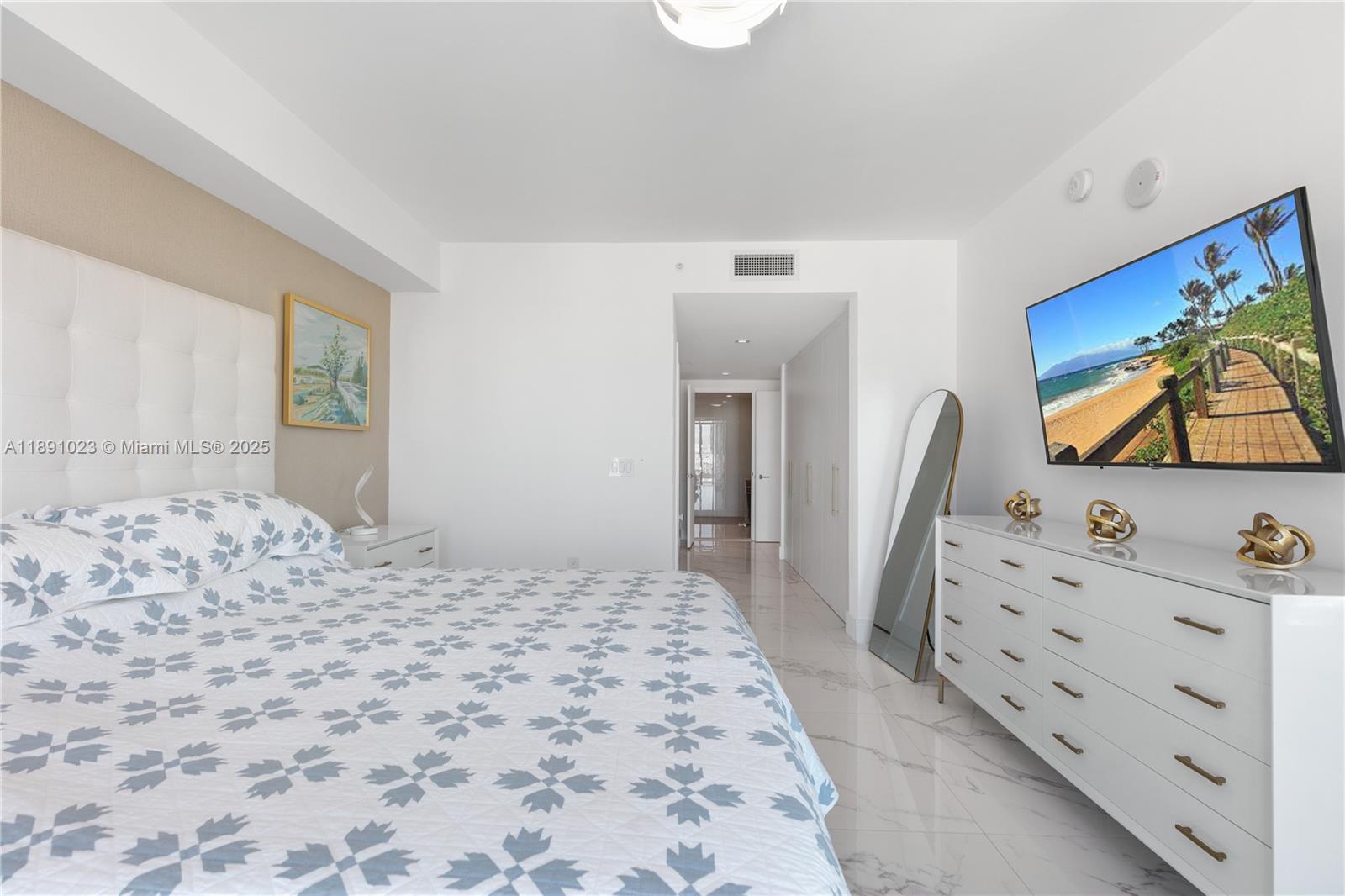 300 Sunny Isles Boulevard, Unit 41607 Sunny Isles Beach, FL 33160 - Photo 13 of 73 a bedroom with a bed and a flat screen tv