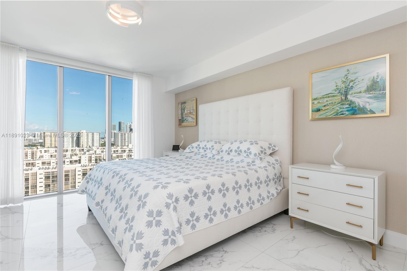 300 Sunny Isles Boulevard, Unit 41607 Sunny Isles Beach, FL 33160 - Photo 18 of 73 a bedroom with a bed and a window