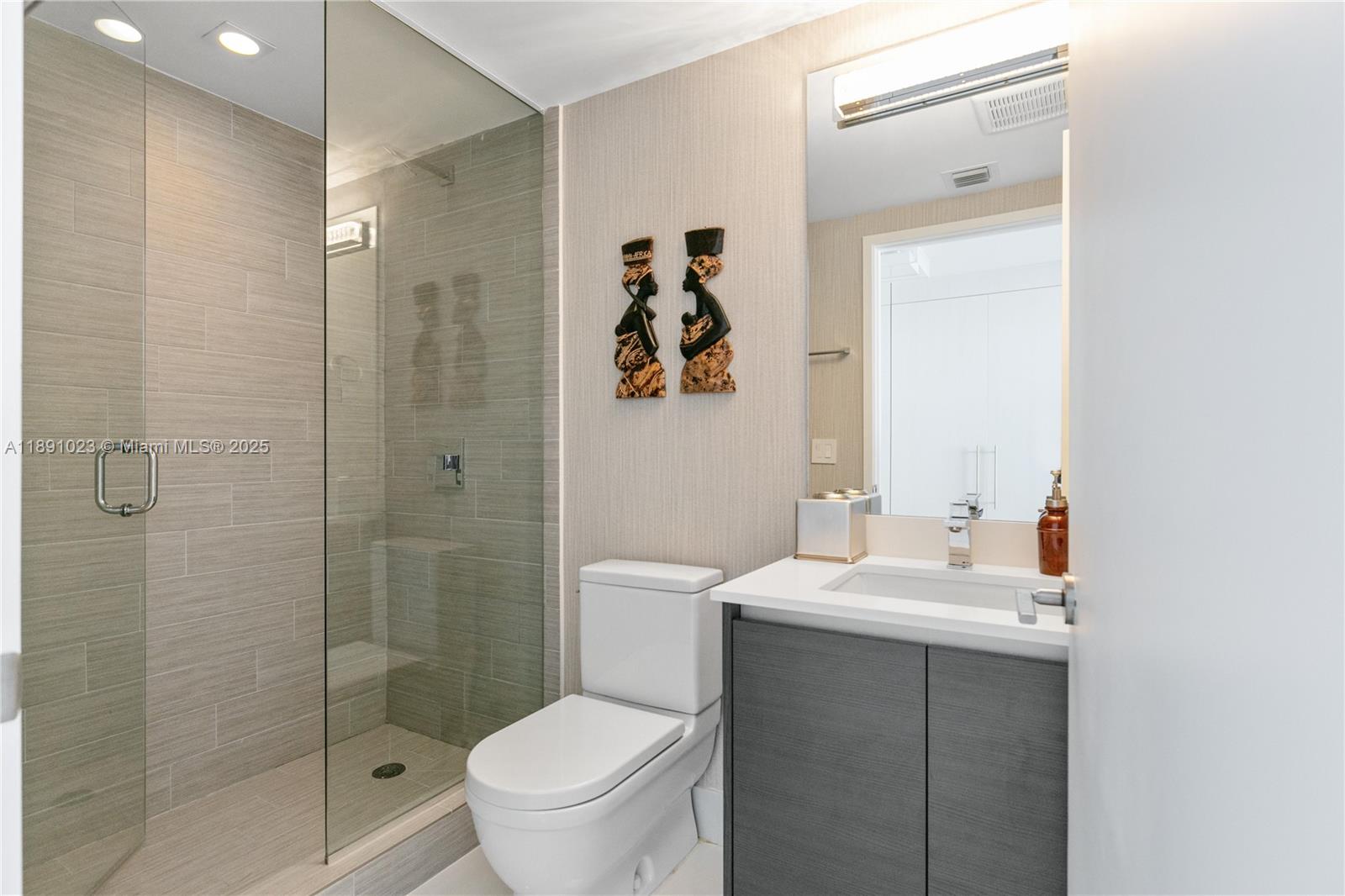 300 Sunny Isles Boulevard, Unit 41607 Sunny Isles Beach, FL 33160 - Photo 24 of 73 a bathroom with a sink toilet and shower