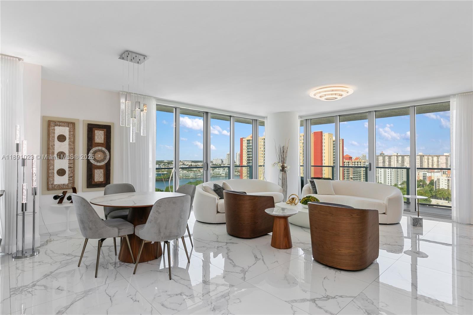 300 Sunny Isles Boulevard, Unit 41607 Sunny Isles Beach, FL 33160 - Photo 3 of 73 a dining room with furniture and a floor to ceiling window