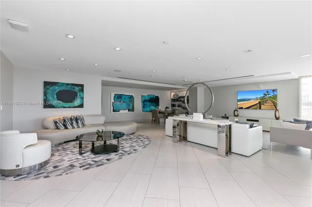 a view of a porch with chairs and backyard