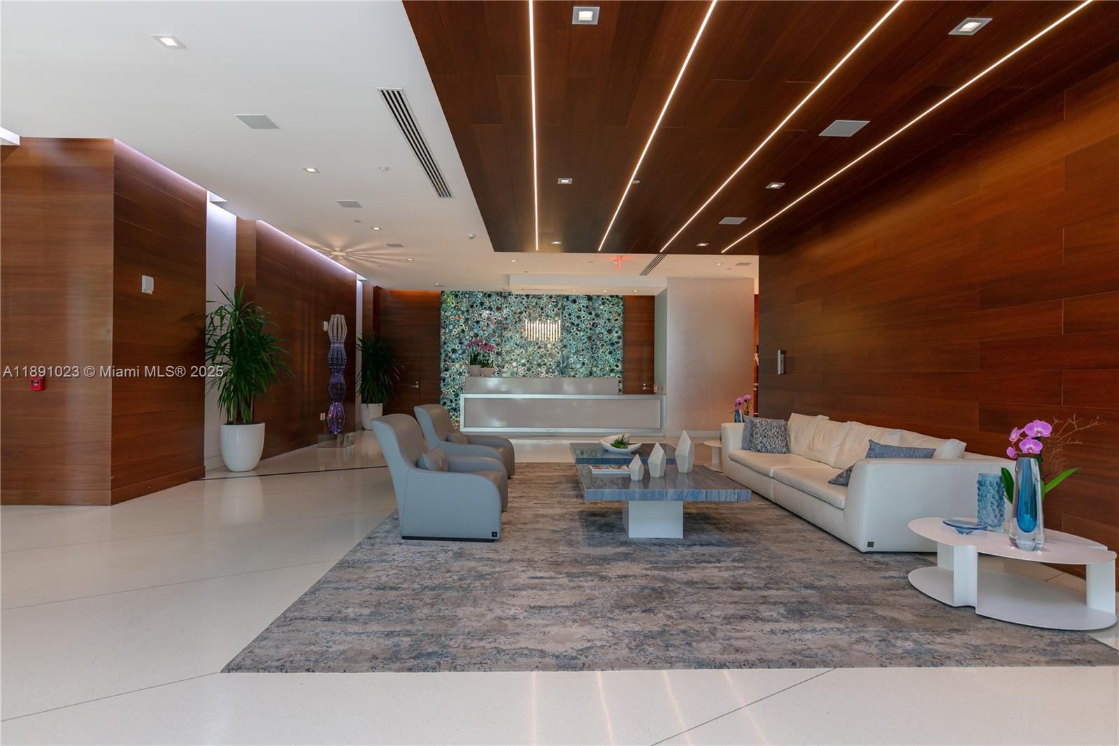 300 Sunny Isles Boulevard, Unit 41607 Sunny Isles Beach, FL 33160 - Photo 46 of 73 a living room with furniture and a potted plant