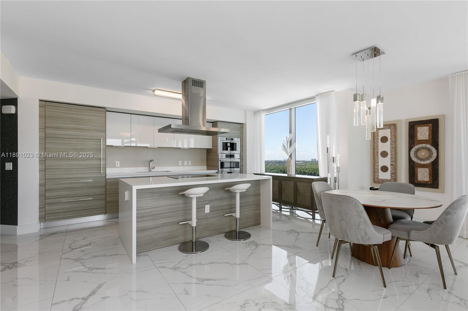 300 Sunny Isles Boulevard, Unit 41607 Sunny Isles Beach, FL 33160 - Photo 8 of 73 a kitchen with a table chairs and a refrigerator