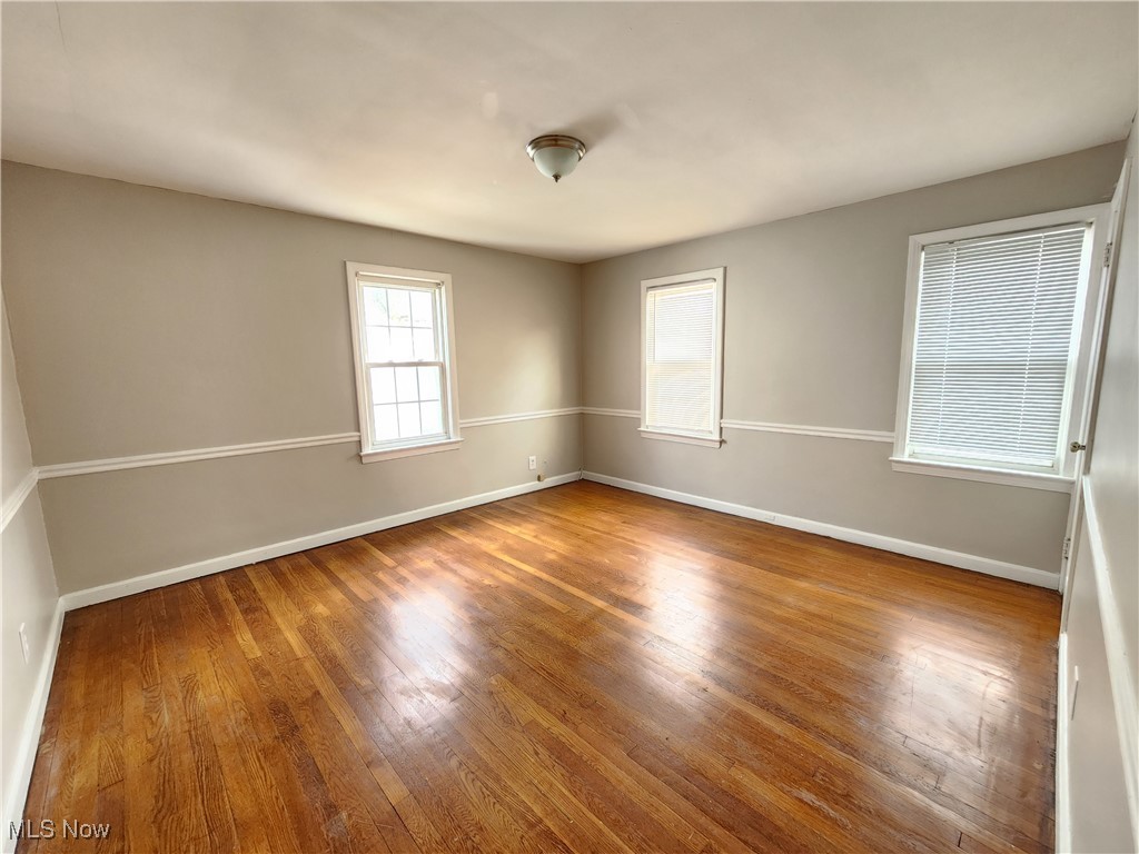 1160 Brentwood Road Cleveland, OH 44121 - Photo 17 of 26 Unfurnished bedroom with hardwood flooring