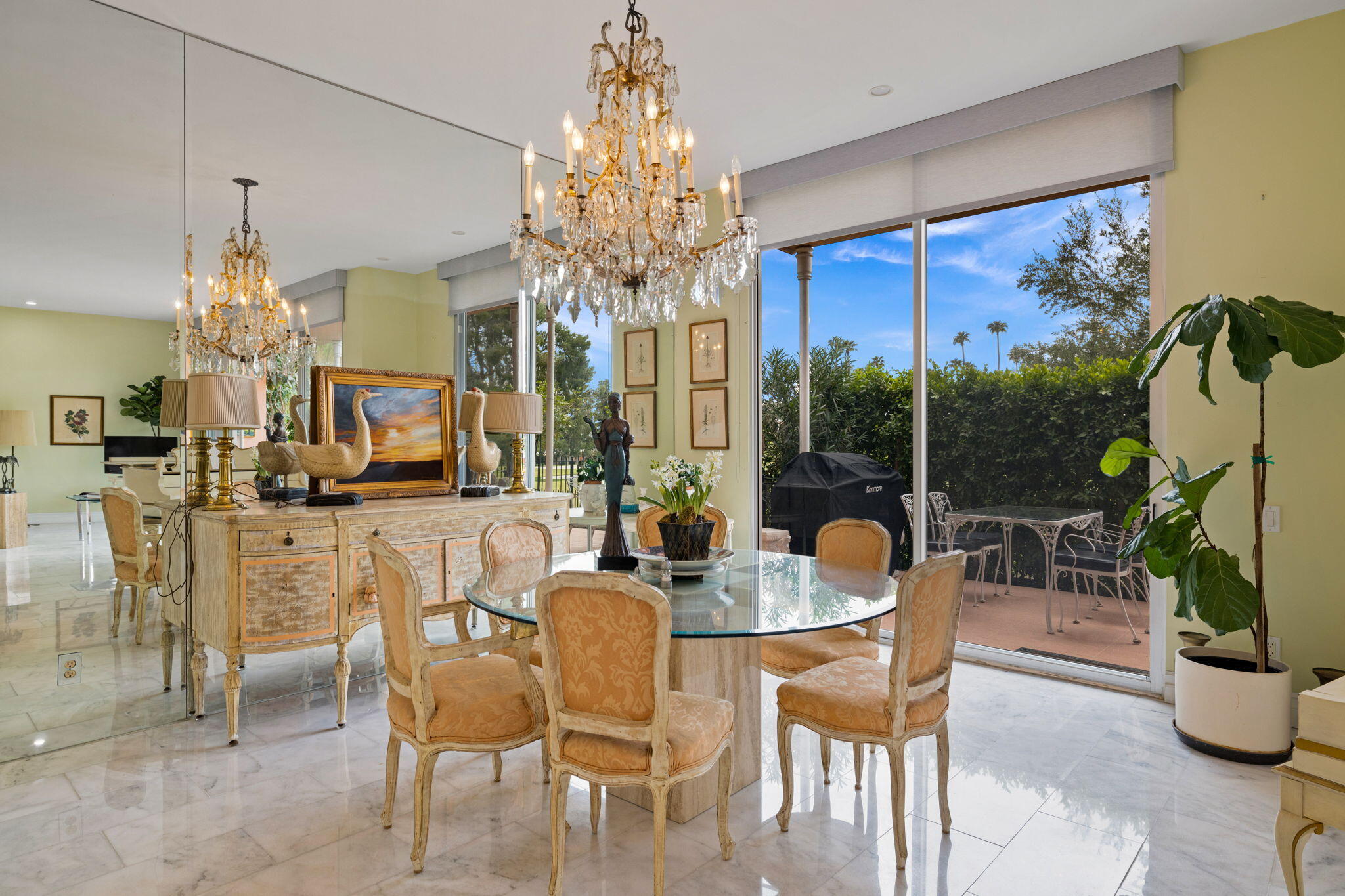 47432 Rabat Drive Palm Desert, CA 92260 - Photo 11 of 46 a dining room with furniture a chandelier and window