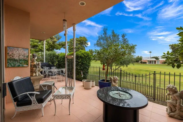 a view of a chairs and tables in the patio