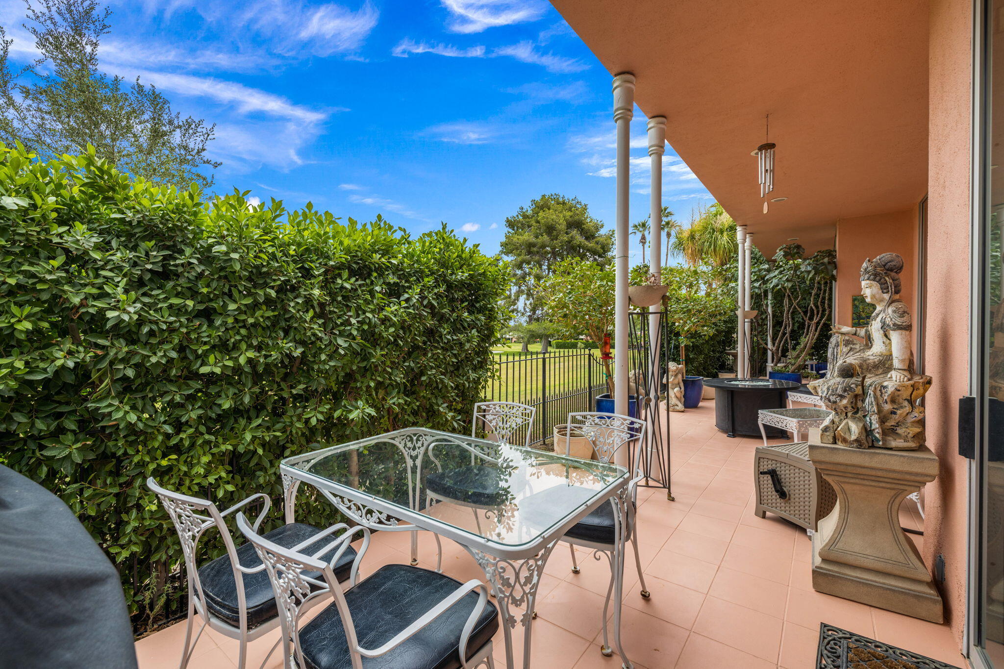 47432 Rabat Drive Palm Desert, CA 92260 - Photo 16 of 46 a view of a patio with couches table and chairs and potted plants