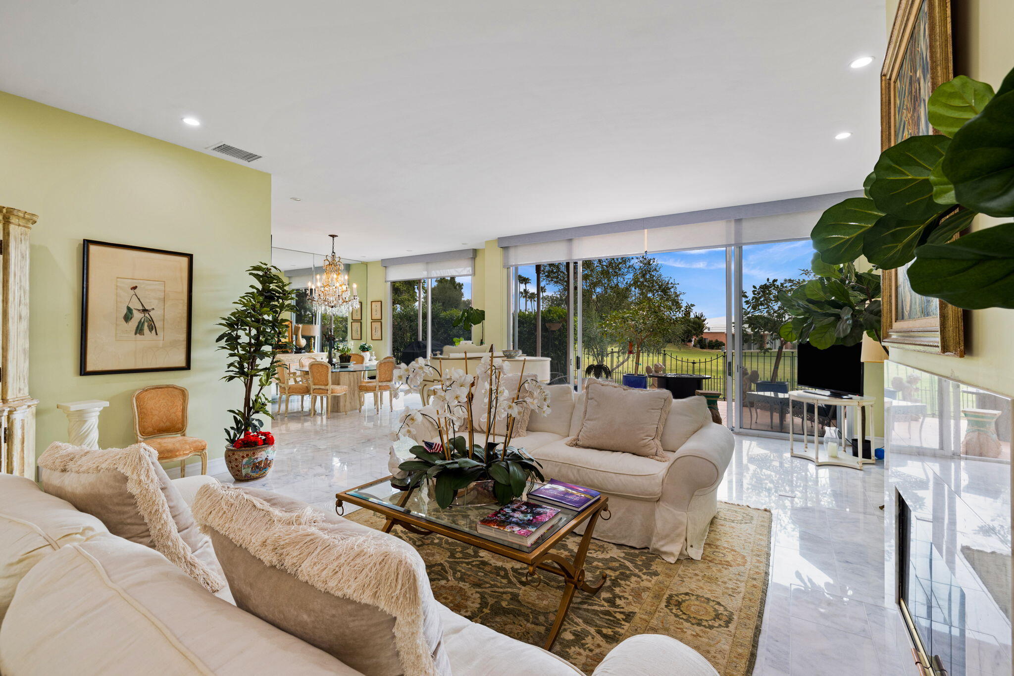 47432 Rabat Drive Palm Desert, CA 92260 - Photo 2 of 46 a living room with furniture floor to ceiling window and a potted plant