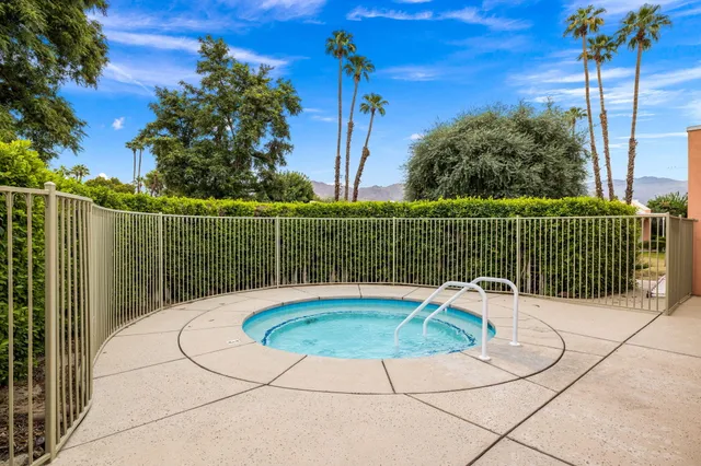 a view of a swimming pool with a patio
