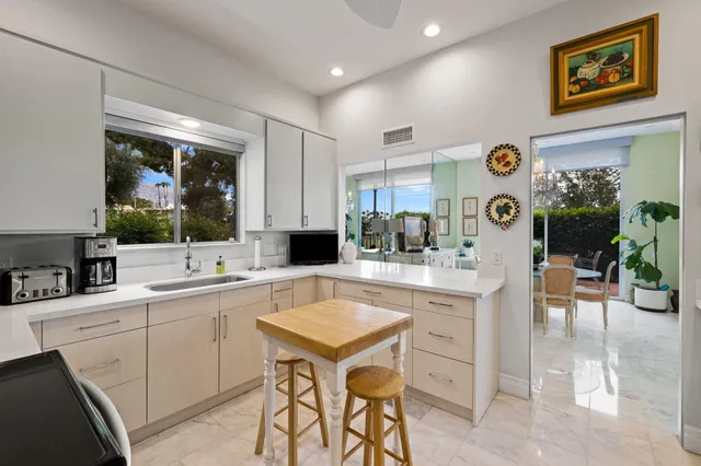 a kitchen with a sink and cabinets
