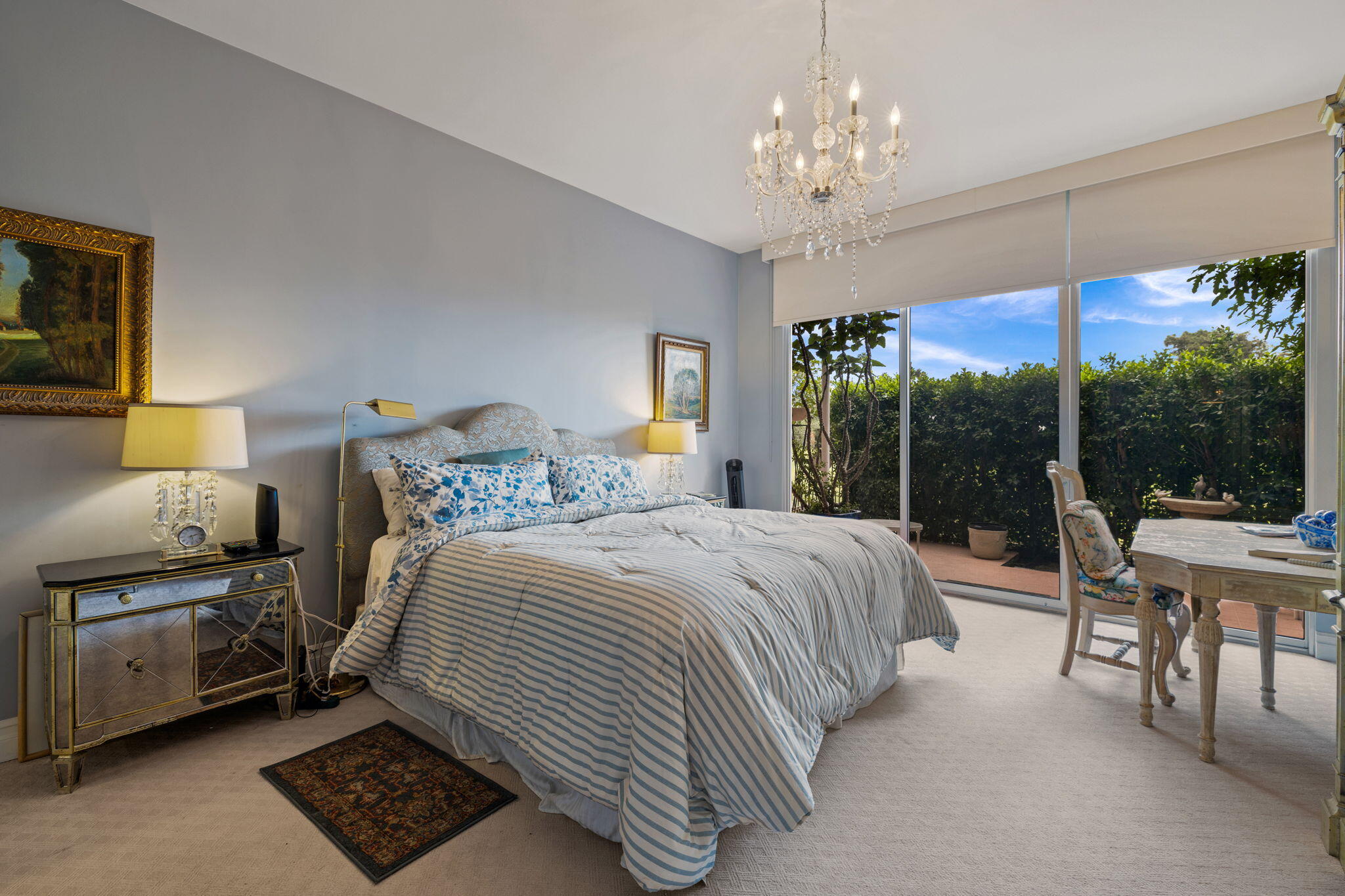 47432 Rabat Drive Palm Desert, CA 92260 - Photo 30 of 46 a bedroom with a bed and a chandelier