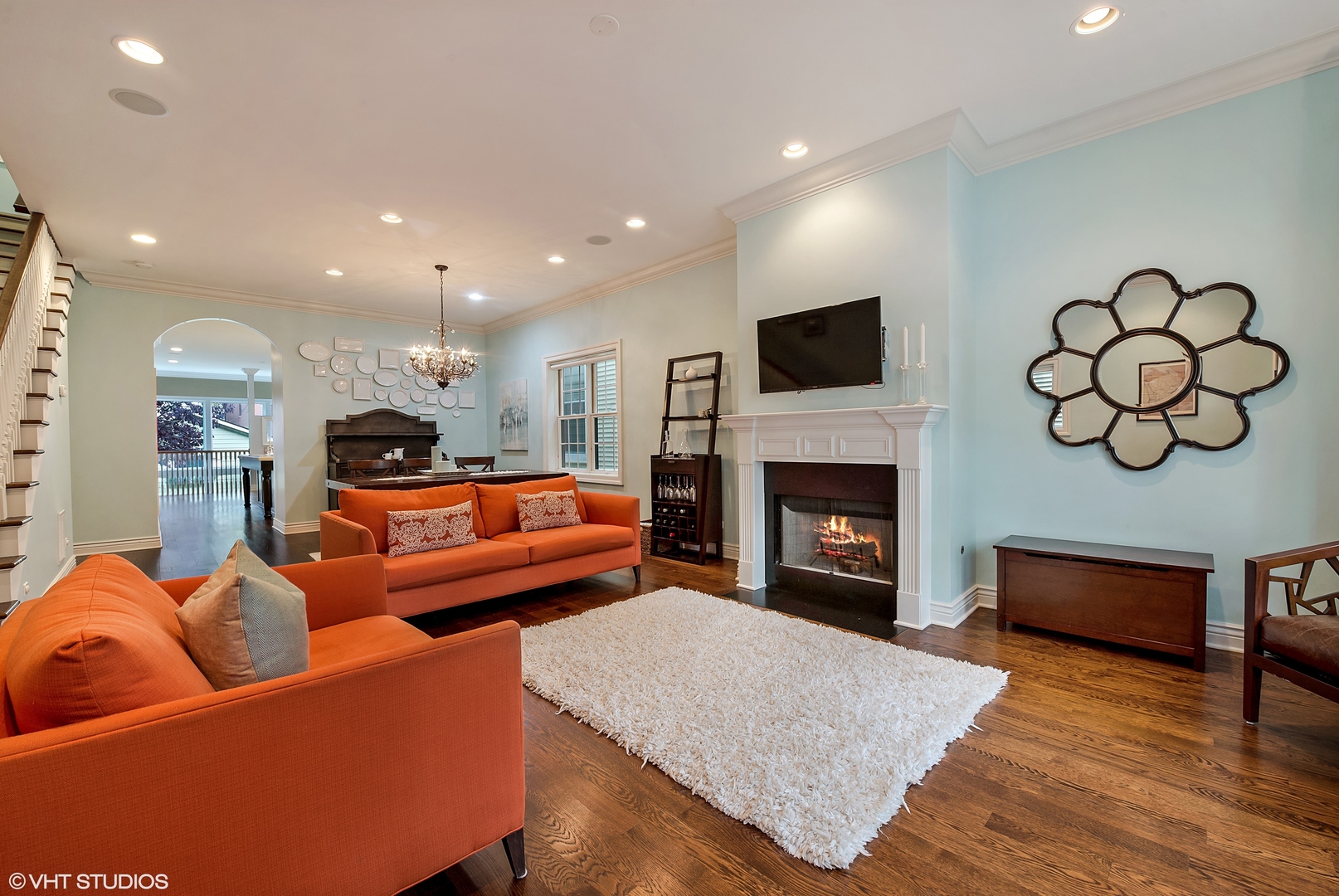 1834 West School Street Chicago, IL 60657 - Photo 2 of 21 a living room with furniture a fireplace and a flat screen tv