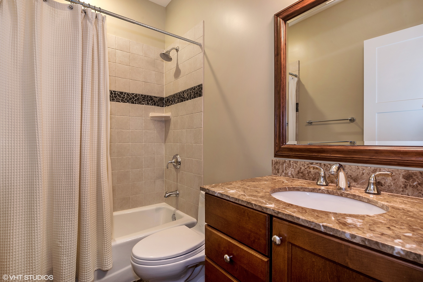 1834 West School Street Chicago, IL 60657 - Photo 18 of 21 a bathroom with a granite countertop sink toilet and shower
