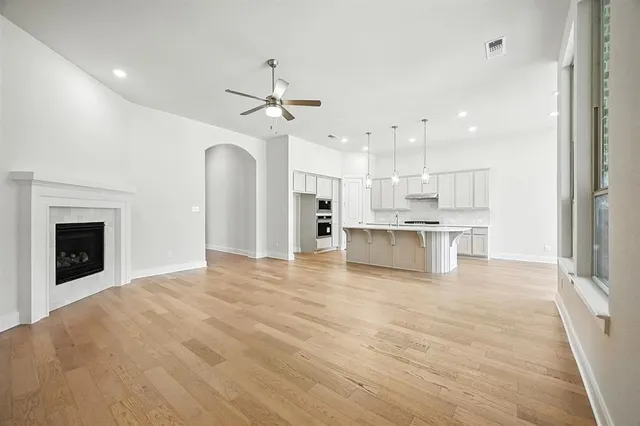 a kitchen with a stove a sink and a refrigerator
