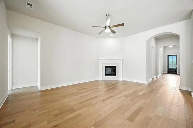 a kitchen with kitchen island stainless steel appliances a sink a stove a refrigerator and cabinets