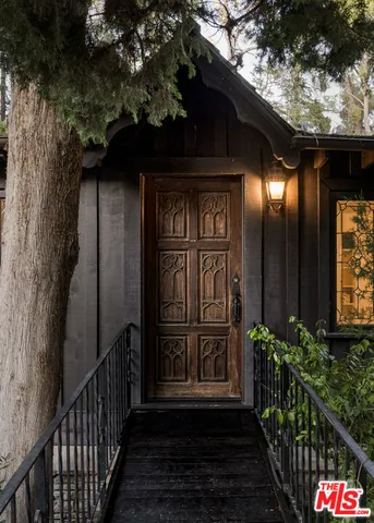 a view of entryway door with wooden floor