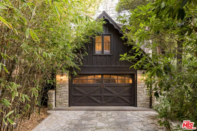 a view of a pathway of a house with a yard