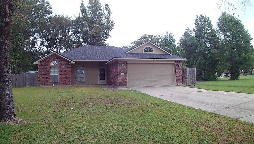 708 Quiet Cove Circle Shreveport, LA 71118 - Photo 1 of 1 a front view of a house with a yard and garage
