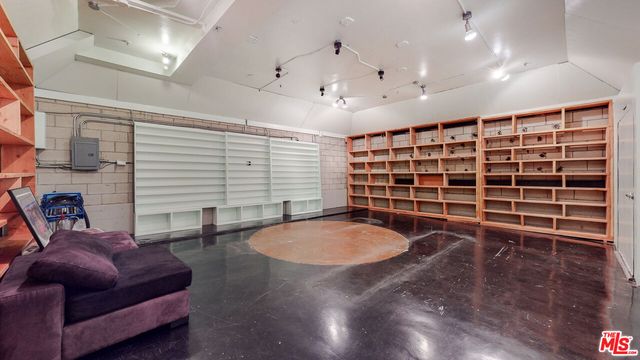 a view of a balcony with two chairs and a table