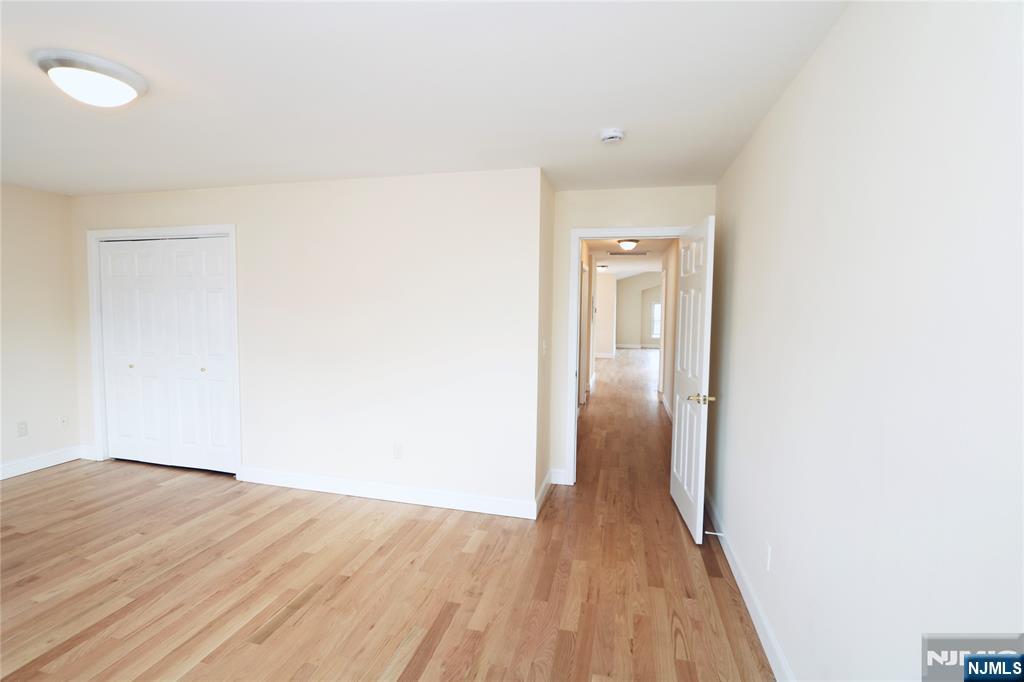 23 Main Avenue Wallington, NJ 07057 - Photo 27 of 29 a view of hallway with wooden floor