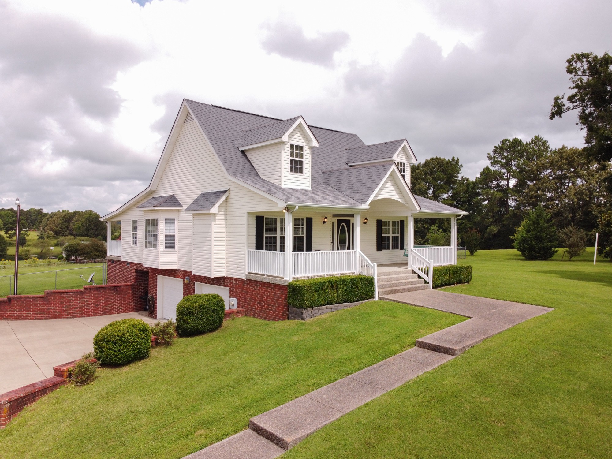 1678 Porter Road Bon Aqua, TN 37025 - Photo 1 of 36 a front view of house with yard and green space