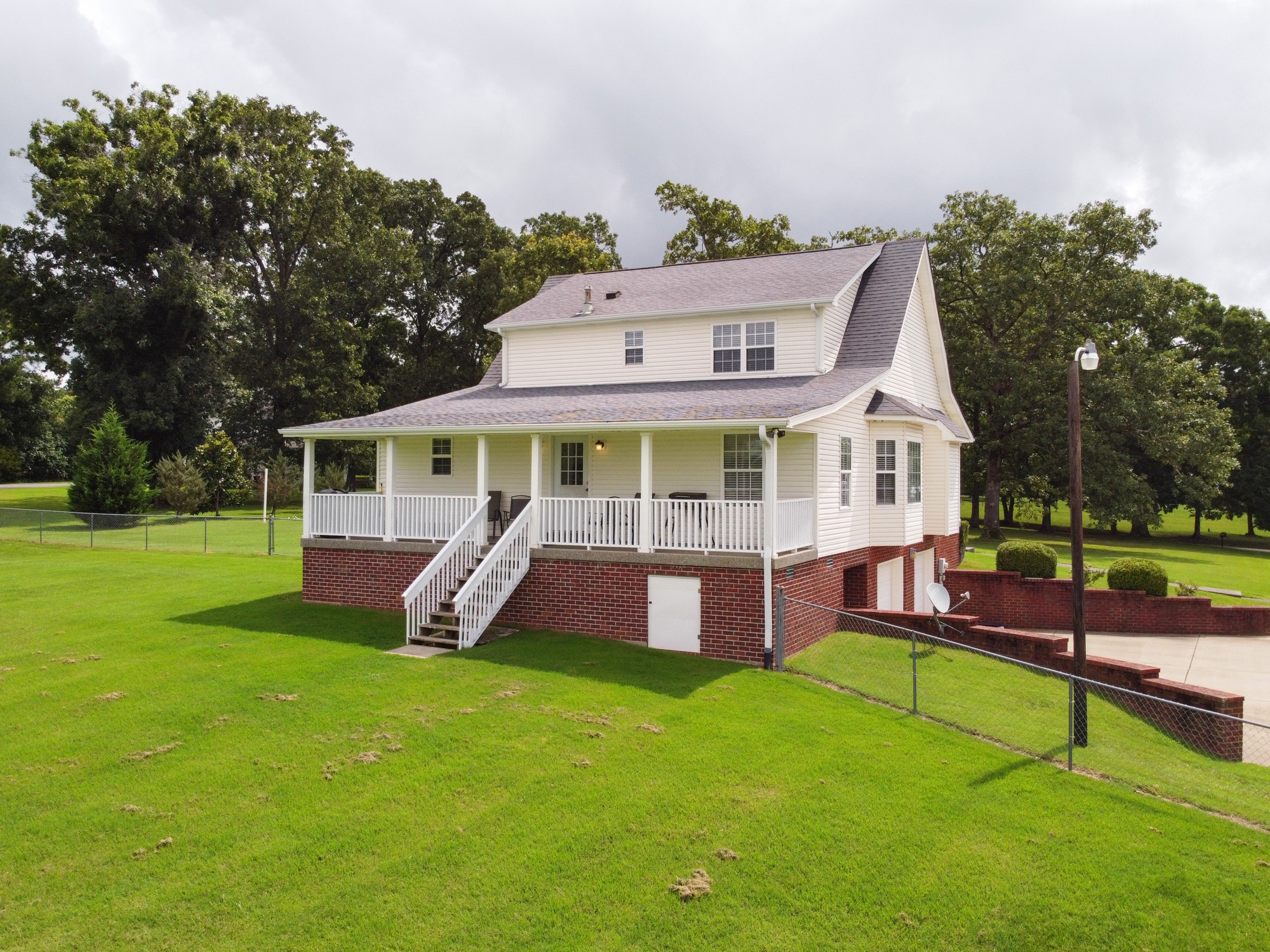 1678 Porter Road Bon Aqua, TN 37025 - Photo 11 of 36 front view of a house with a yard table and chairs