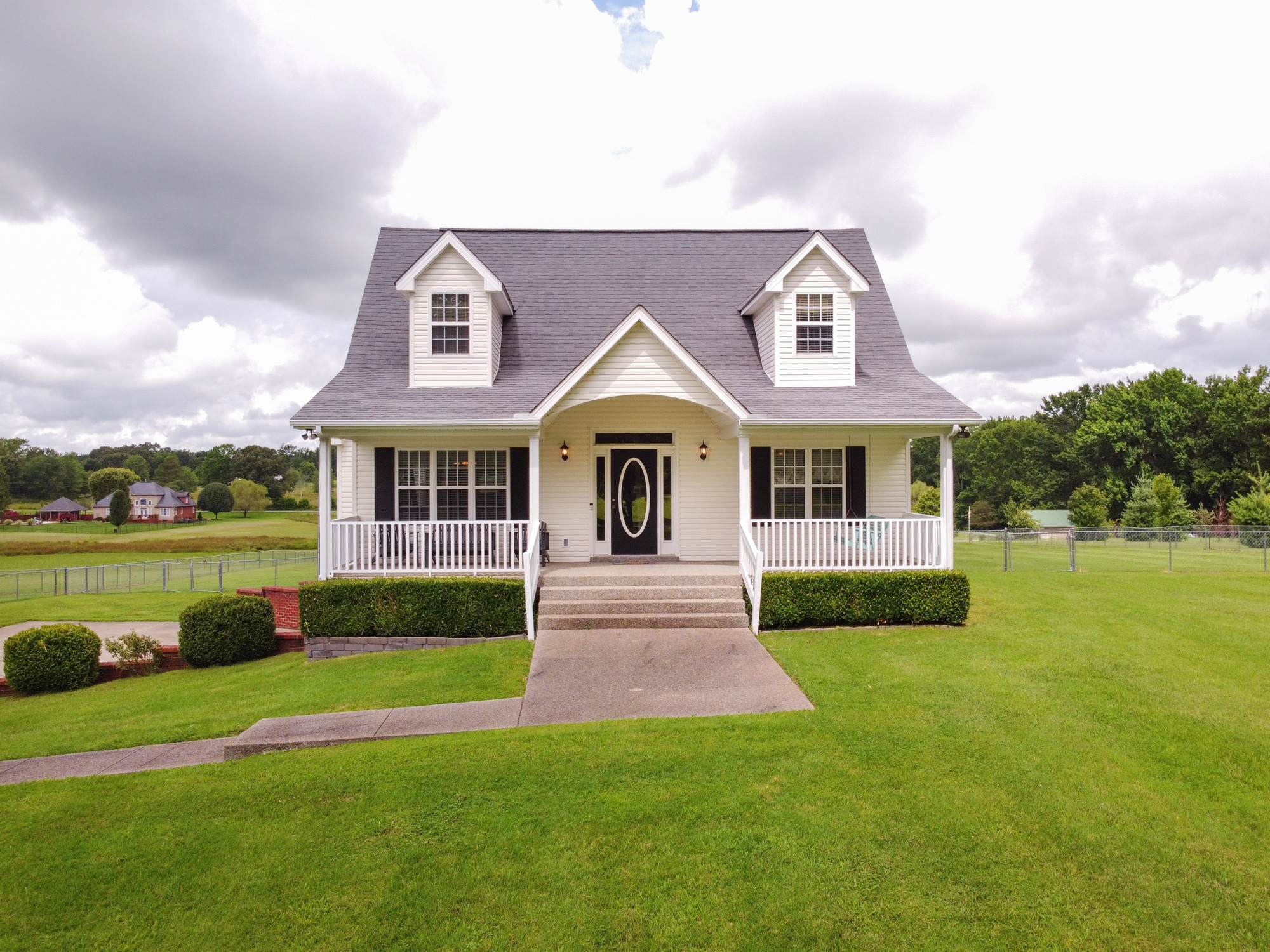 1678 Porter Road Bon Aqua, TN 37025 - Photo 3 of 36 a front view of a house with garden