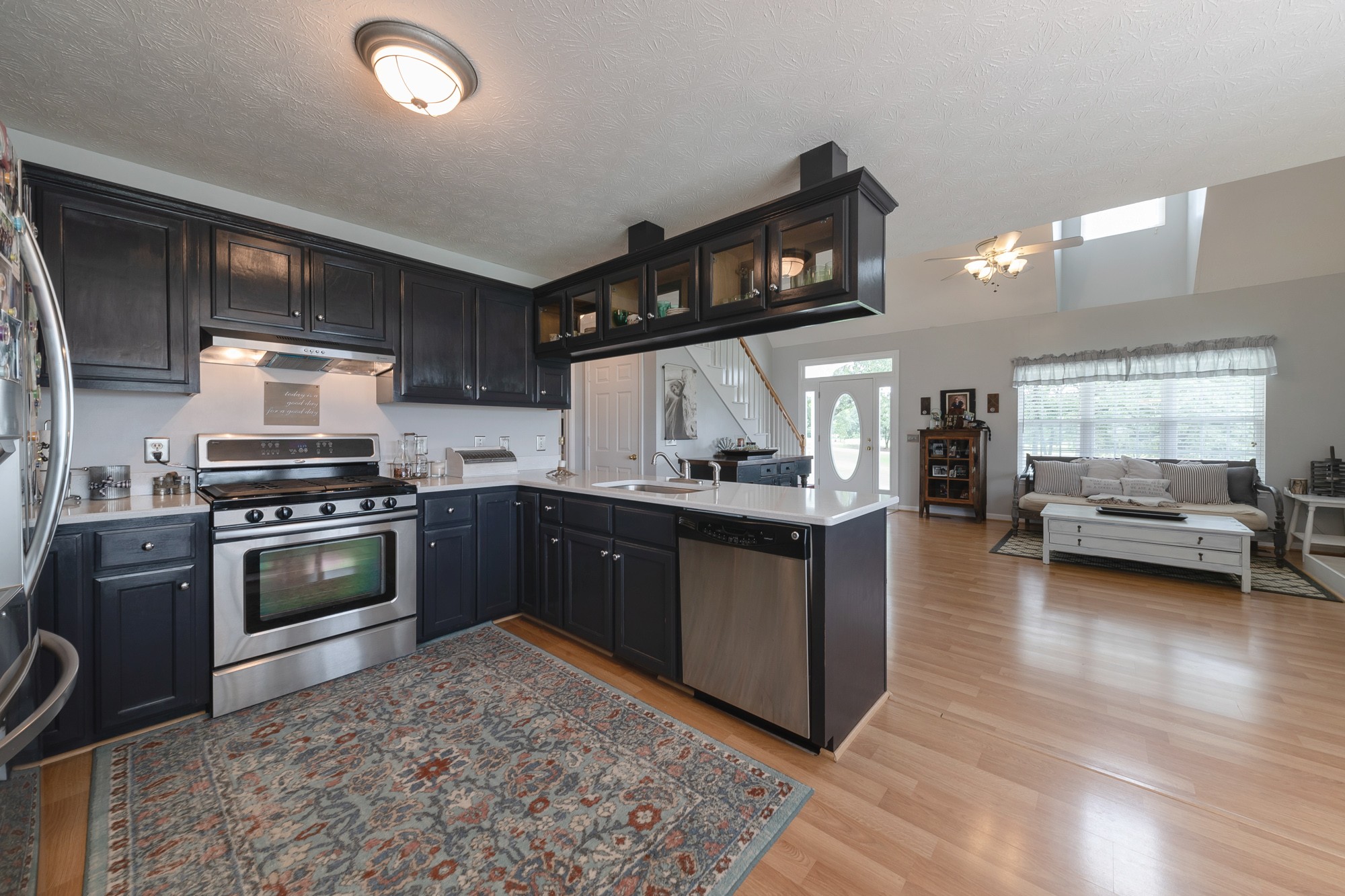 1678 Porter Road Bon Aqua, TN 37025 - Photo 22 of 36 a kitchen with a stove and a microwave