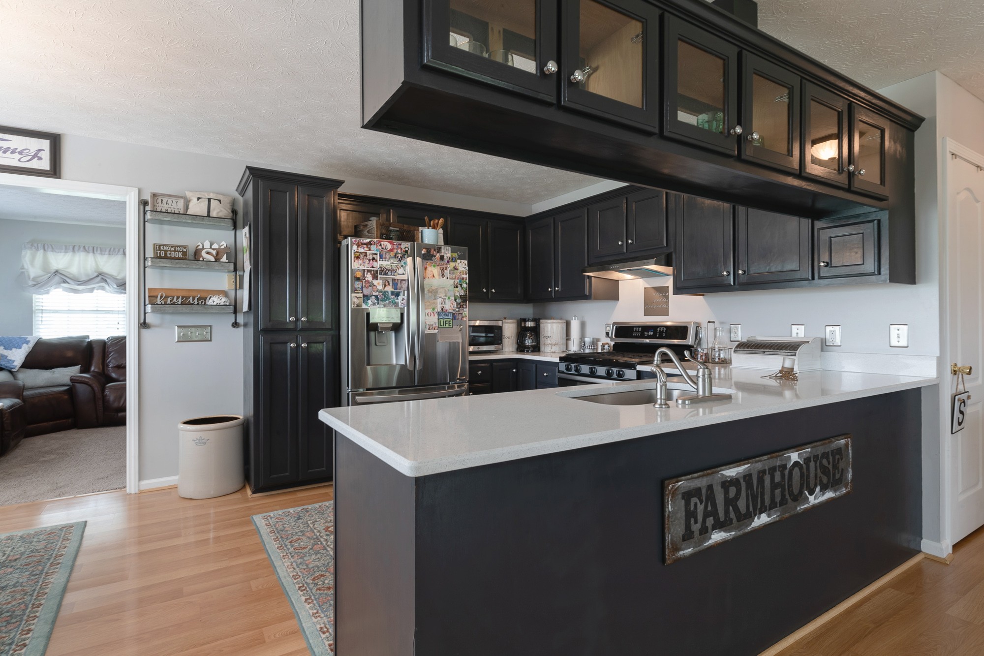 1678 Porter Road Bon Aqua, TN 37025 - Photo 24 of 36 a kitchen with refrigerator and cabinets