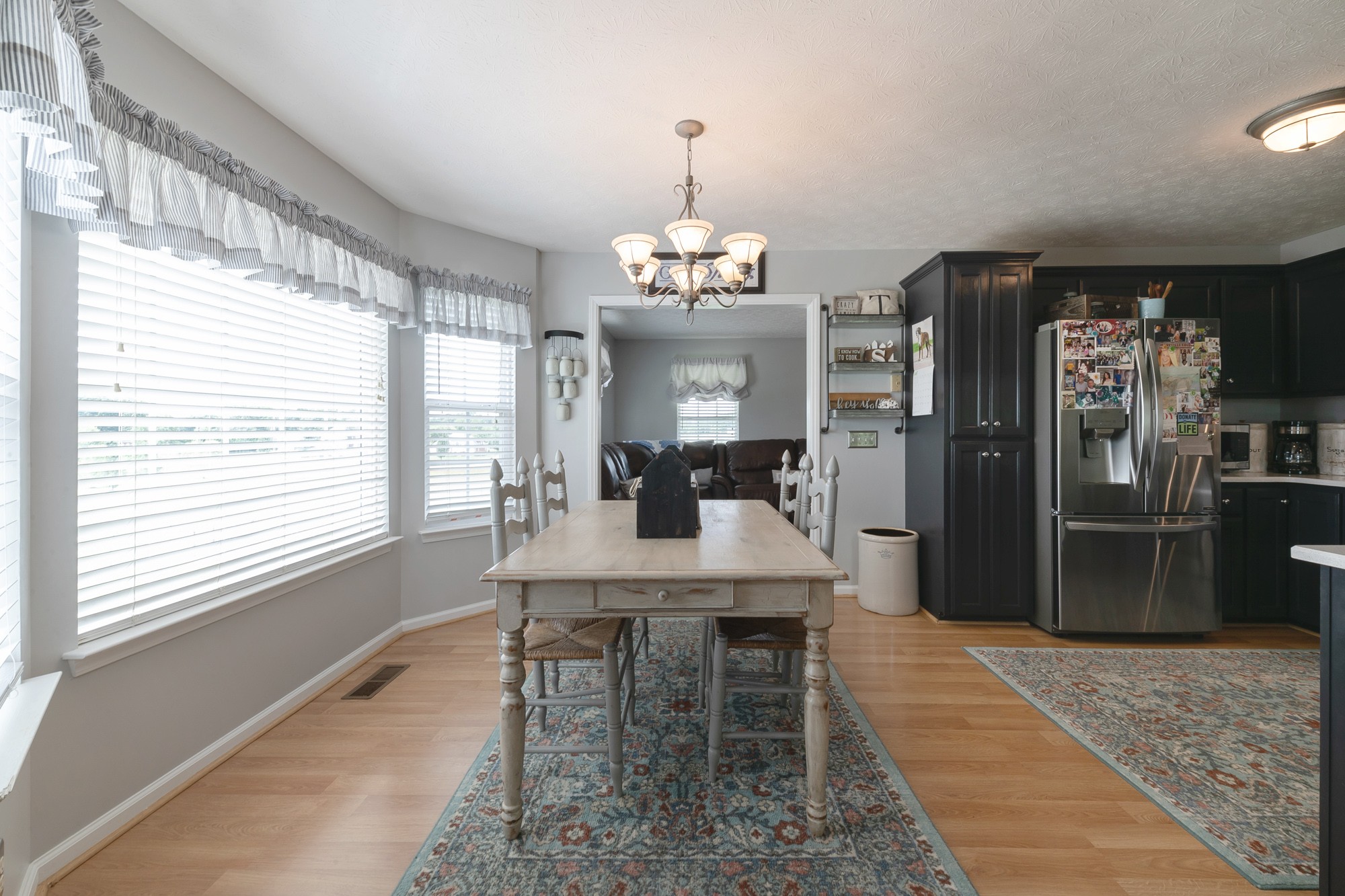 1678 Porter Road Bon Aqua, TN 37025 - Photo 25 of 36 a view of a dining room with furniture window and wooden floor