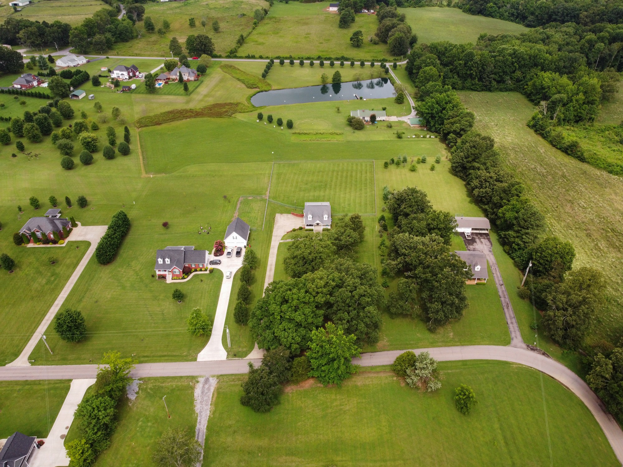 1678 Porter Road Bon Aqua, TN 37025 - Photo 4 of 36 an aerial view of a residential houses with outdoor space and swimming pool