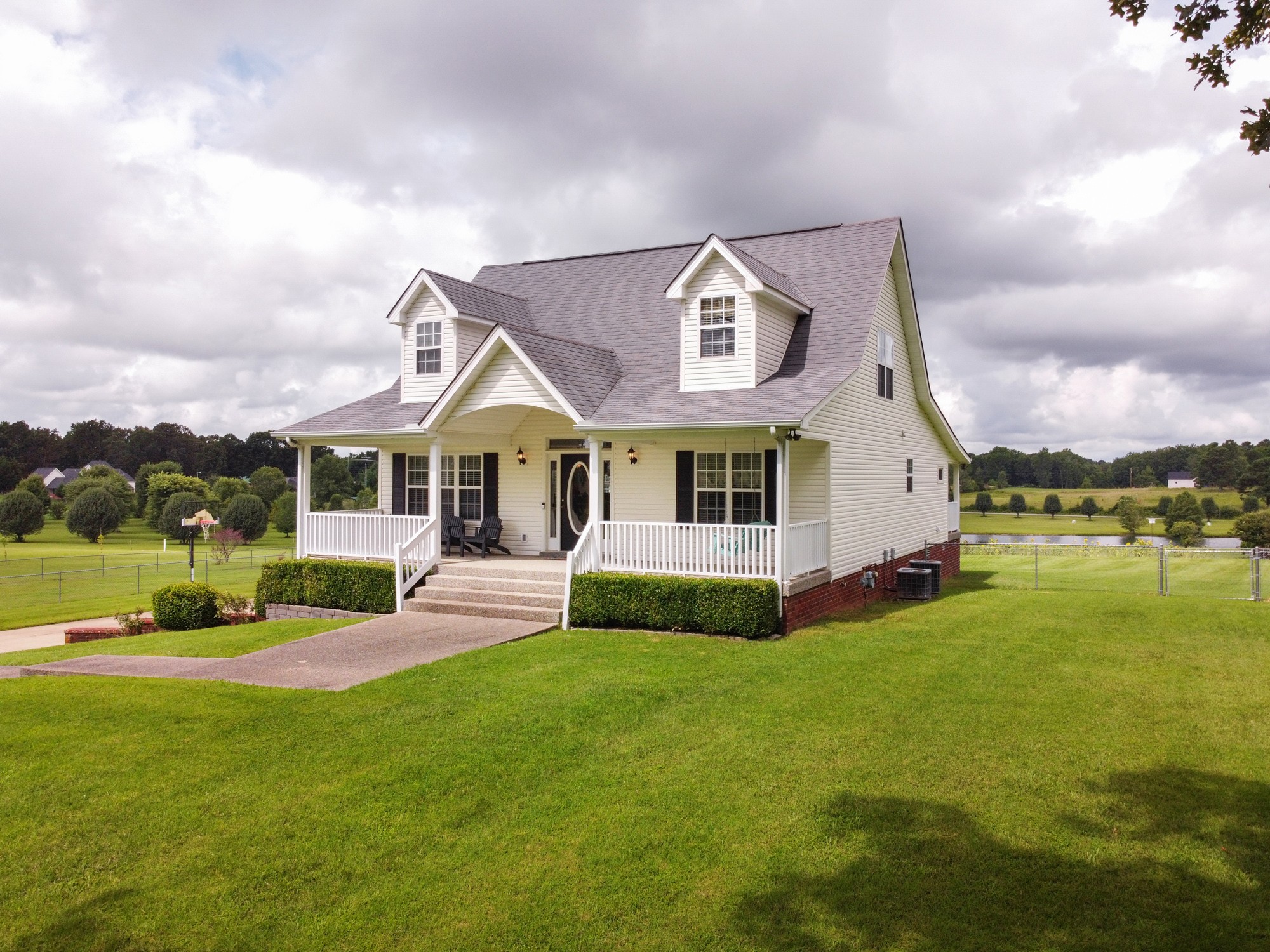 1678 Porter Road Bon Aqua, TN 37025 - Photo 5 of 36 a front view of a house with garden