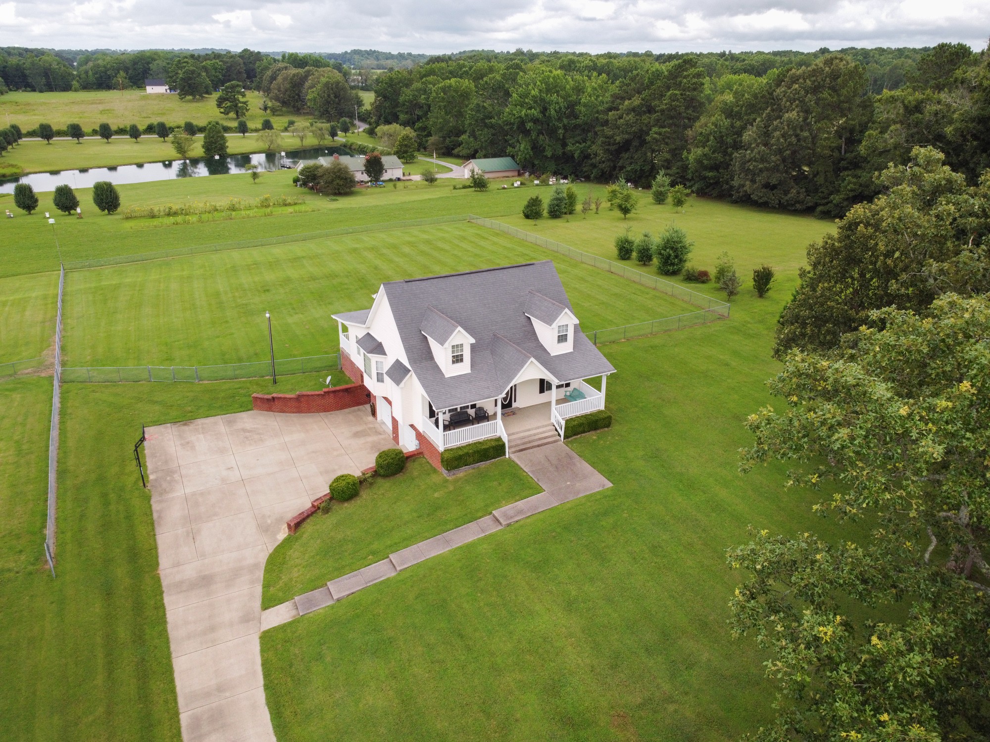1678 Porter Road Bon Aqua, TN 37025 - Photo 9 of 36 a view of a garden with lawn chairs