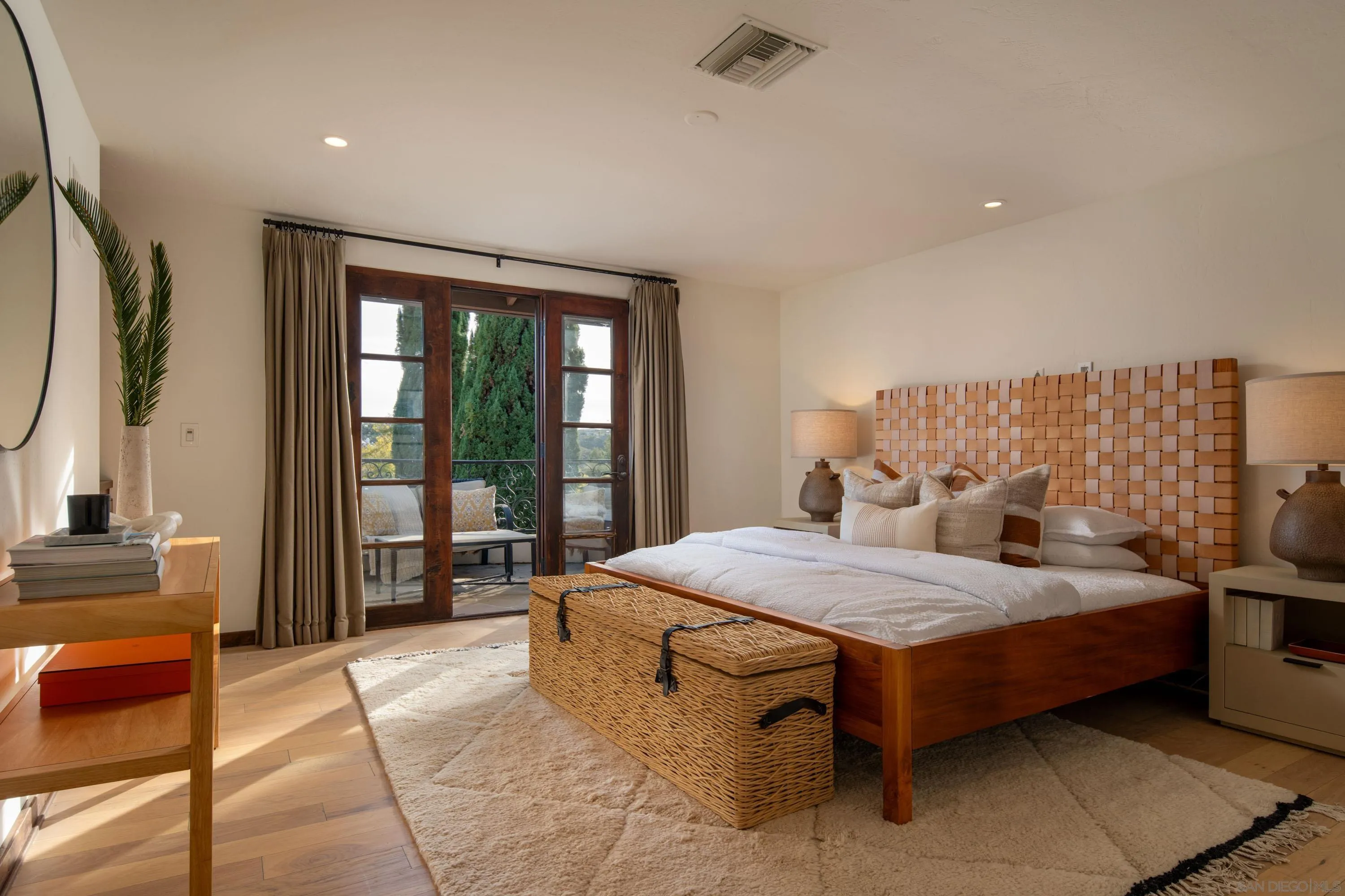 6511 Poco Lago Rancho Santa Fe, CA 92067 - Photo 12 of 24 a bedroom with a bed and large windows